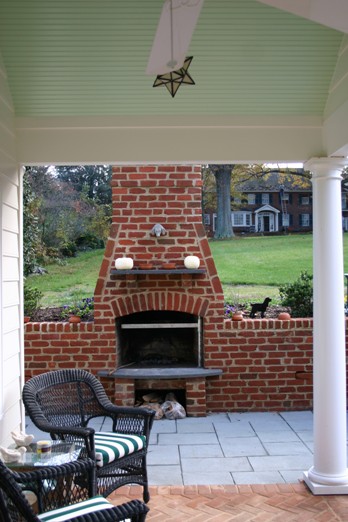 Brick Outdoor Fireplace Build into a Retaining Wall