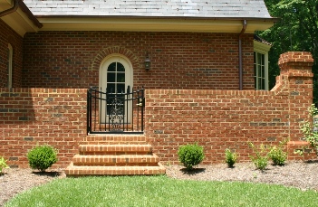 Brick wall With Iron Gate