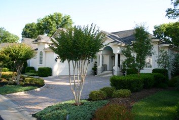 Cobblestone Edge by Concrete Paver Driveway