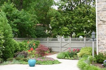 A creative planting design of trees, shrubs, groundcovers and perennials