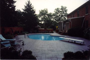 Pool with brick walls and wall fountain