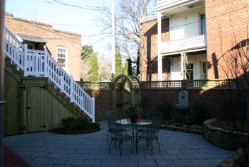 Urban Garden with brick walls and Navastone Pavers