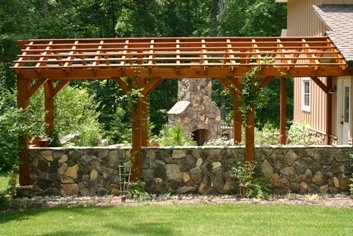 Pergola of Natural Wood and a Stone Wall