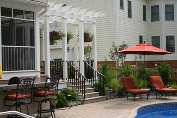 Pergola over a deck by a pool