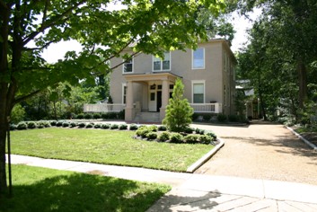 A beautifully landscaped stucco home