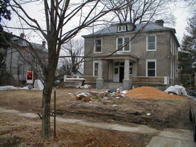 Stucco house under construction before landscaping