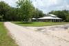 The driveway to the garage and front of the house